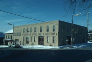 NW CNR OF N GERMAN ST AND E BRIDGE ST, a Commercial Vernacular industrial building, built in Mayville, Wisconsin in 1876.