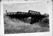 Scofield Rd. over C&NW railroad (Astico County park), a NA (unknown or not a building) pony truss bridge, built in Elba, Wisconsin in 1883.