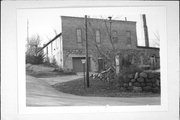 NW CNR OF MILL ST AT HENNI ST NW CNR OF MILL ST AT HENNI ST, a Commercial Vernacular brewery/distillery/winery, built in Theresa, Wisconsin in 1855.