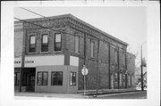 301-303 E MAIN ST, a Italianate retail building, built in Waupun, Wisconsin in 1870.