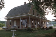 9390 CEMETERY RD, a Dutch Colonial Revival house, built in Brussels, Wisconsin in 1921.