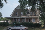 9390 CEMETERY RD, a Dutch Colonial Revival house, built in Brussels, Wisconsin in 1921.