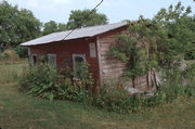 9390 CEMETERY RD, a Dutch Colonial Revival house, built in Brussels, Wisconsin in 1921.