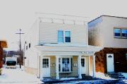 210 OAKTON AVE, a Commercial Vernacular small retail building, built in Pewaukee, Wisconsin in 1900.