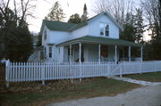 4209 CEDAR ST, a Gabled Ell house, built in Gibraltar, Wisconsin in 1880.
