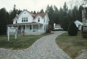 4135 BLUFF LN, a Side Gabled lodging-inn, built in Gibraltar, Wisconsin in 1902.