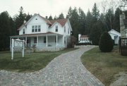 4135 BLUFF LN, a Side Gabled inn, built in Gibraltar, Wisconsin in 1902.