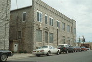 211 N 3RD AVE, a Romanesque Revival retail building, built in Sturgeon Bay, Wisconsin in 1899.