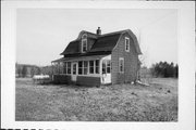 4462 HIGHWAY 57, a Dutch Colonial Revival house, built in Sevastopol, Wisconsin in 1920.