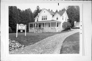 4135 BLUFF LN, a Side Gabled lodging-inn, built in Gibraltar, Wisconsin in 1902.