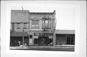 49 N 3RD AVE, a Queen Anne retail building, built in Sturgeon Bay, Wisconsin in 1900.