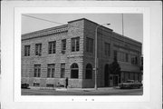 211 N 3RD AVE, a Romanesque Revival retail building, built in Sturgeon Bay, Wisconsin in 1899.