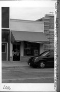 26 S 3RD AVE, a Commercial Vernacular small retail building, built in Sturgeon Bay, Wisconsin in 1895.