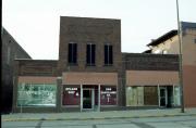 208 EAU CLAIRE ST, a Commercial Vernacular small retail building, built in Eau Claire, Wisconsin in 1875.