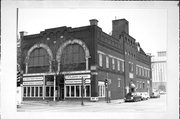 317-319 S BARSTOW ST / 306 MAIN ST, a Romanesque Revival retail building, built in Eau Claire, Wisconsin in 1899.