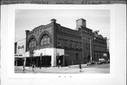 317-319 S BARSTOW ST / 306 MAIN ST, a Romanesque Revival retail building, built in Eau Claire, Wisconsin in 1899.