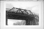 OLD WELLS RD AND RR TRACKS, a NA (unknown or not a building) pony truss bridge, built in Eau Claire, Wisconsin in 1911.