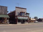 107 N RAILROAD ST, a Commercial Vernacular small retail building, built in Eagle River, Wisconsin in 1888.