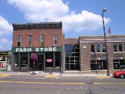 213-215 N BRIDGE ST, a Commercial Vernacular small retail building, built in Chippewa Falls, Wisconsin in 1889.