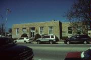 246 E MAIN ST, a Art/Streamline Moderne post office, built in Stoughton, Wisconsin in 1938.