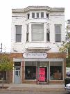 1218-1220 CALEDONIA ST, a Queen Anne small retail building, built in La Crosse, Wisconsin in 1895.