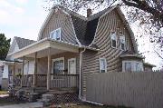 513 3RD ST, a Dutch Colonial Revival house, built in Menasha, Wisconsin in .