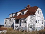 PLUM ISLAND, NE TIP, a Shingle Style lifesaving station facility/lighthouse, built in Washington, Wisconsin in 1897.