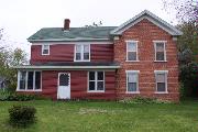 1209 89TH AVE (USH 12), a Gabled Ell house, built in Warren, Wisconsin in 1870.