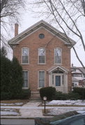 225 SHEBOYGAN ST, a Greek Revival house, built in Fond du Lac, Wisconsin in 1875.