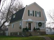 2060 S 72ND ST, a Dutch Colonial Revival house, built in West Allis, Wisconsin in 1909.