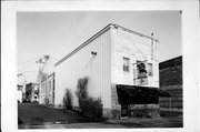 126 N MADISON ST, a Commercial Vernacular small retail building, built in Lancaster, Wisconsin in 1889.