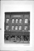 115-125 E MAIN ST, a Italianate large retail building, built in Platteville, Wisconsin in 1906.
