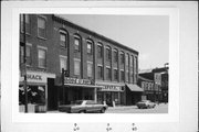 40-60 W MAIN ST, a Romanesque Revival large retail building, built in Platteville, Wisconsin in 1866.
