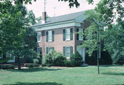 621 14TH AVE, a Greek Revival house, built in Monroe, Wisconsin in 1857.