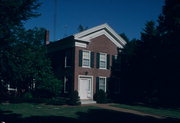 621 14TH AVE, a Greek Revival house, built in Monroe, Wisconsin in 1857.