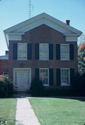 621 14TH AVE, a Greek Revival house, built in Monroe, Wisconsin in 1857.