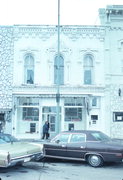 1007 16TH AVE, a Italianate retail building, built in Monroe, Wisconsin in 1869.