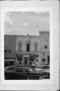 1007 16TH AVE, a Italianate small retail building, built in Monroe, Wisconsin in 1869.