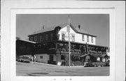 100 6TH AVENUE, a Greek Revival lodging-hotel, built in New Glarus, Wisconsin in 1853.