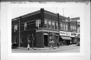 119-121-123-123A W HURON ST, a Queen Anne retail building, built in Berlin, Wisconsin in 1895.