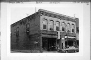 139-139A-141-141A W HURON ST, a Italianate retail building, built in Berlin, Wisconsin in 1870.