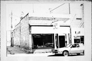 112 N PEARL ST, a Commercial Vernacular small retail building, built in Berlin, Wisconsin in 1895.