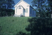 COUNTY HIGHWAY T, a Greek Revival church, built in Ridgeway, Wisconsin in 1862.