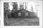 4514 LAKE OF THE FALLS RD, a Rustic Style hunting house, built in Mercer, Wisconsin in 1938.