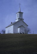 SE of Waterloo at Jct. of Bluse Point and Island Church Rds., a Early Gothic Revival house of worship, built in Waterloo, Wisconsin in 1863.