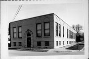 515/517 S 1ST ST, a Romanesque Revival small office building, built in Watertown, Wisconsin in 1926.