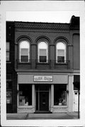 11 E MAIN ST, a Romanesque Revival retail building, built in Watertown, Wisconsin in 1870.