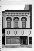 215 E MAIN ST, a Italianate retail building, built in Watertown, Wisconsin in 1874.