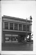 301 E MAIN ST, a Romanesque Revival large retail building, built in Watertown, Wisconsin in 1876.