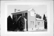 NW CORNER OF WINSOR AND DOCKSTRADER, a Greek Revival house, built in Mauston, Wisconsin in .